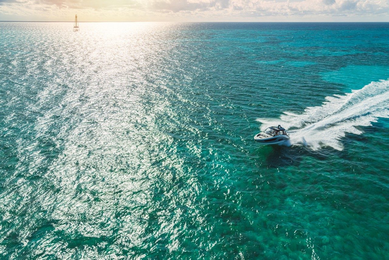 sundancer 370 outboard speeding, aerial shot